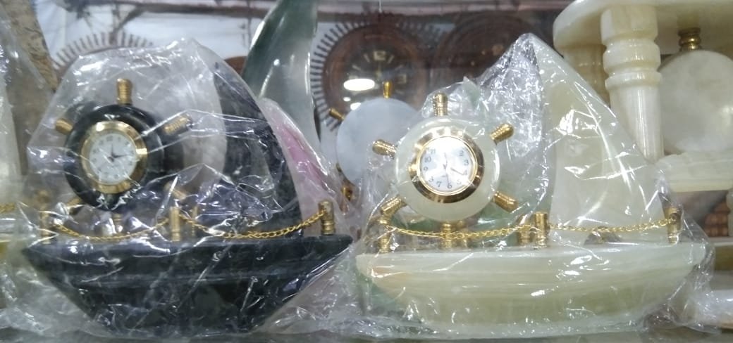 Ship with brass chain table clock.